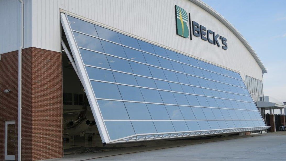 Powerlift Doors, Beck's Seed, Airplane Hangar Door, All Glass