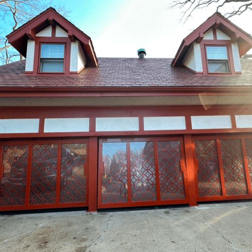 Triple PowerLift Doors with Ornamental Iron Mastery