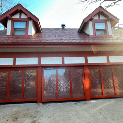 Triple PowerLift Doors with Ornamental Iron Mastery