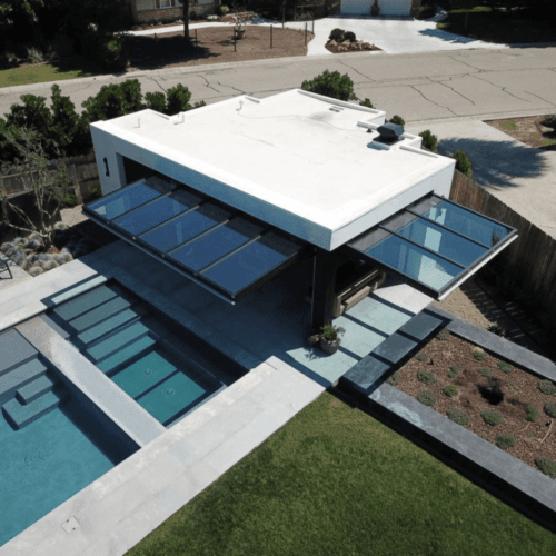 Serene Luxury: The Glass-Walled Pool House