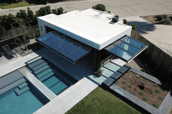 Serene Luxury: The Glass-Walled Pool House