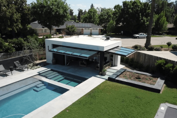 Serene Luxury: The Glass-Walled Pool House