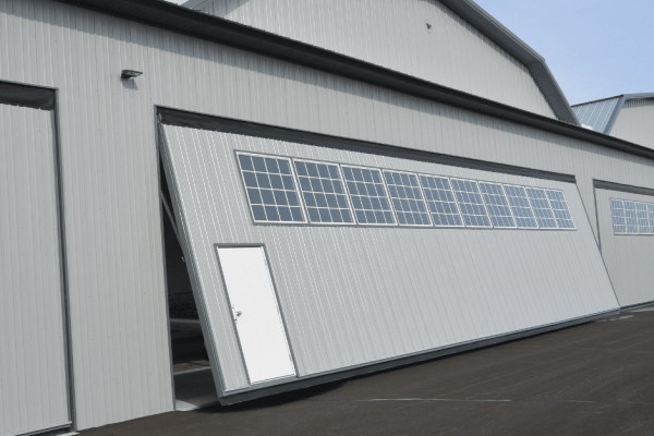 Hangar Titans: The 54'x15' PowerLift Door Revolution