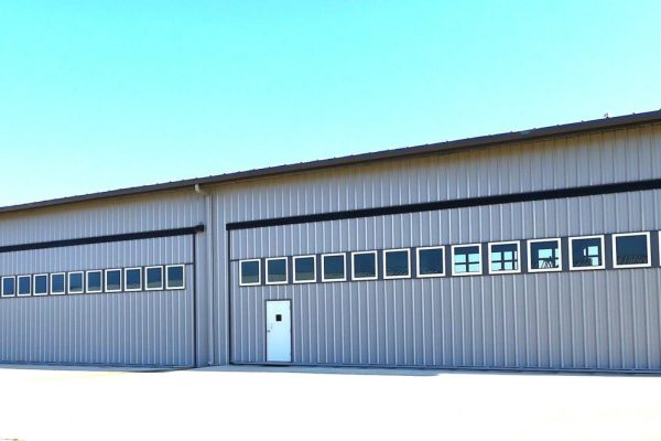 Hangar many windows with 6 - 60-68' x 18' doors IN post PS resized for website (2)